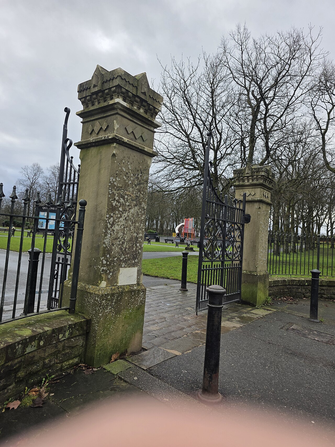 Stone gateposts and iron entrance gates at Queen’s Park in Heywood